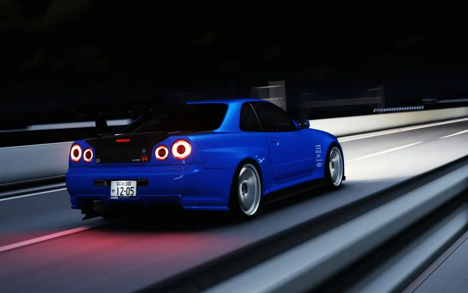 A blue sports car speeds on a highway in Pippu, Hokkaido at night.